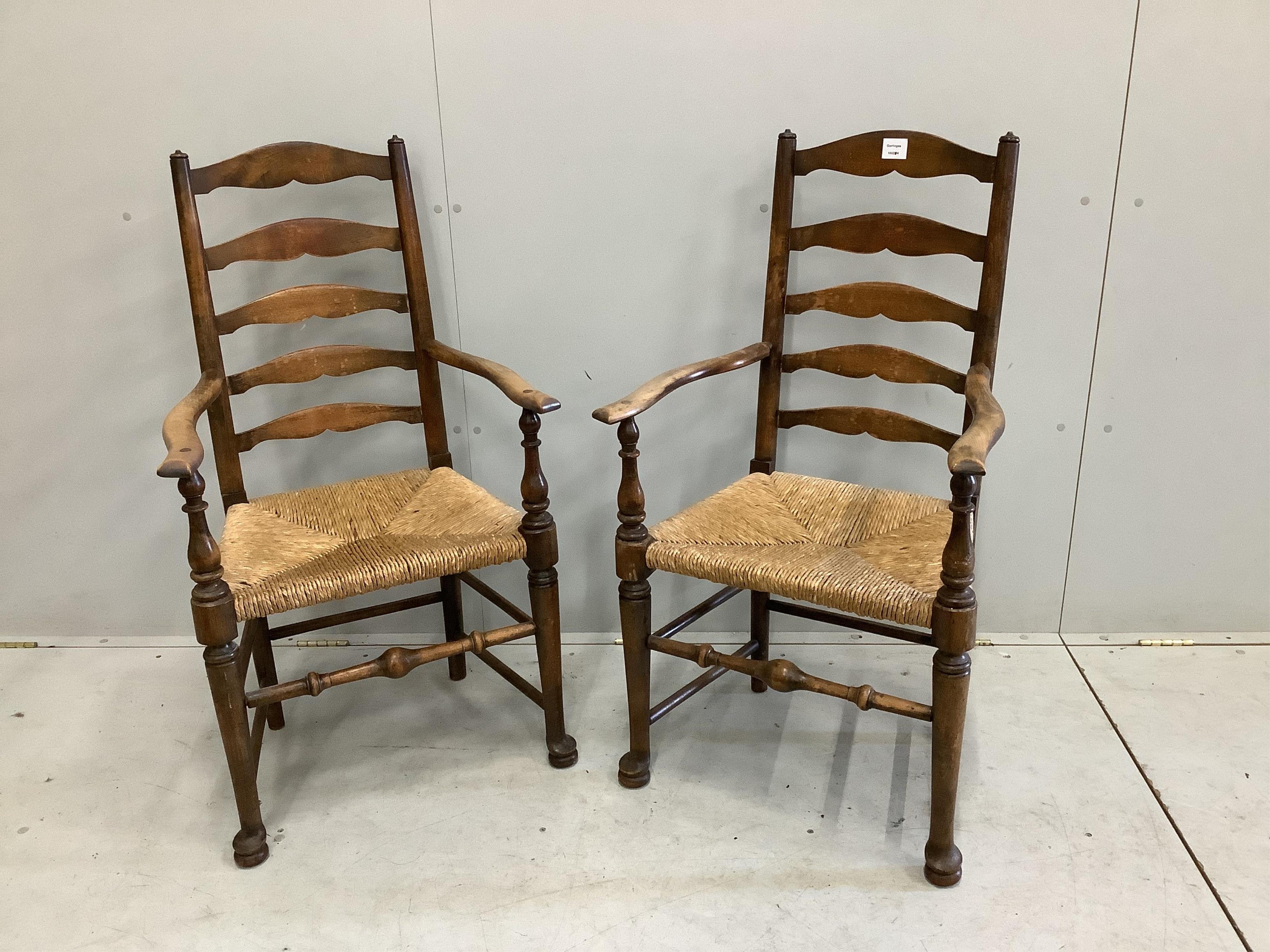 A pair of 19th century beech ladder back elbow chairs, width 54cm, depth 49cm, height 105cm. Condition - poor